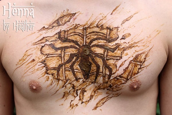 "spiderman_henna_tattoo_chest_design_skin_rip_through"